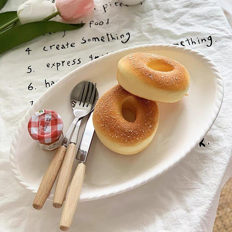 Nordic Style 12-Inch Oval Ceramic Dessert Plate - Retro Twisted Edge in Pure White 12-inch 30cm