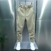 Pantalones informales para hombre, cintura elástica, botones, bragueta, pantalones largos, bolsillos, cierre de Color sólido, puños de cinta, pantalones de estilo deportivo de tenis