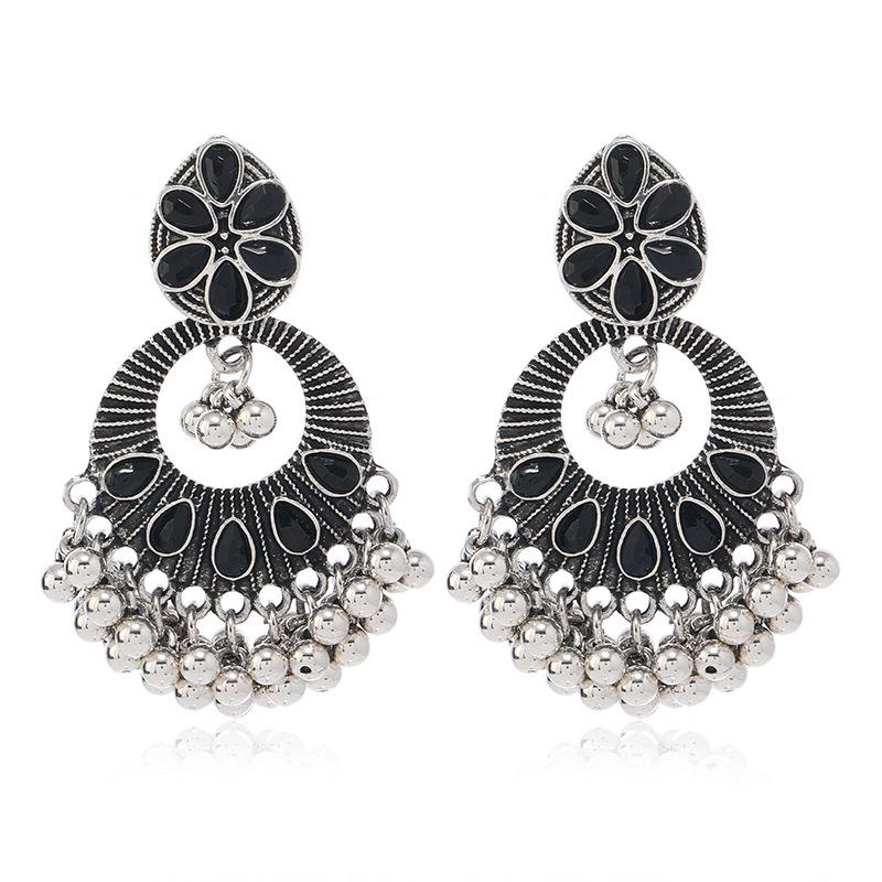 Silver Needle Bohemian Earrings: Retro Ethnic Style, Hollow Crystal Accents, Light Luxury Design.