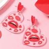 A pair of Valentine's Day acrylic red heart-shaped earrings, sweet personality red lips, niche trend women's earrings.