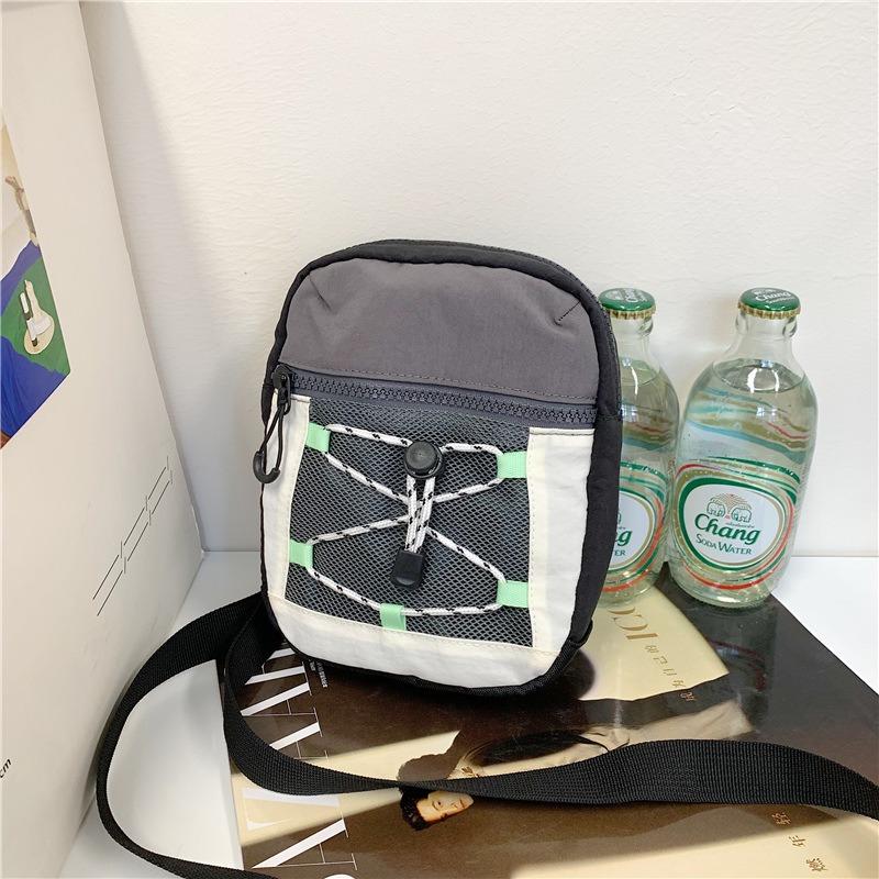 Small square bag new men's and women's street drawstrings out of the street contrasting colors fashionable small backpack