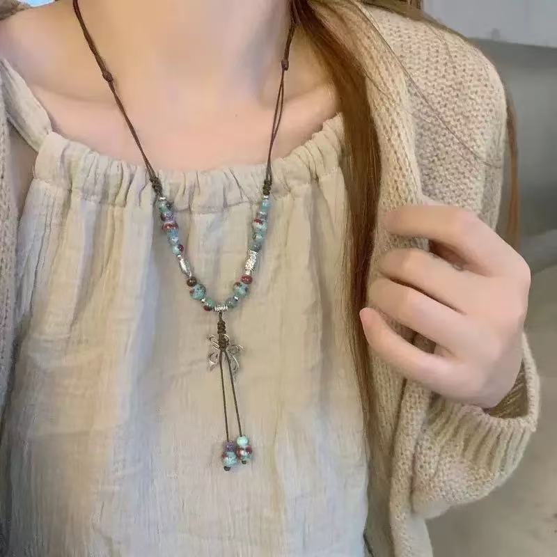Retro pendant, ethnic style ceramic butterfly bell necklace, women's new trendy long sweater chain with accessories