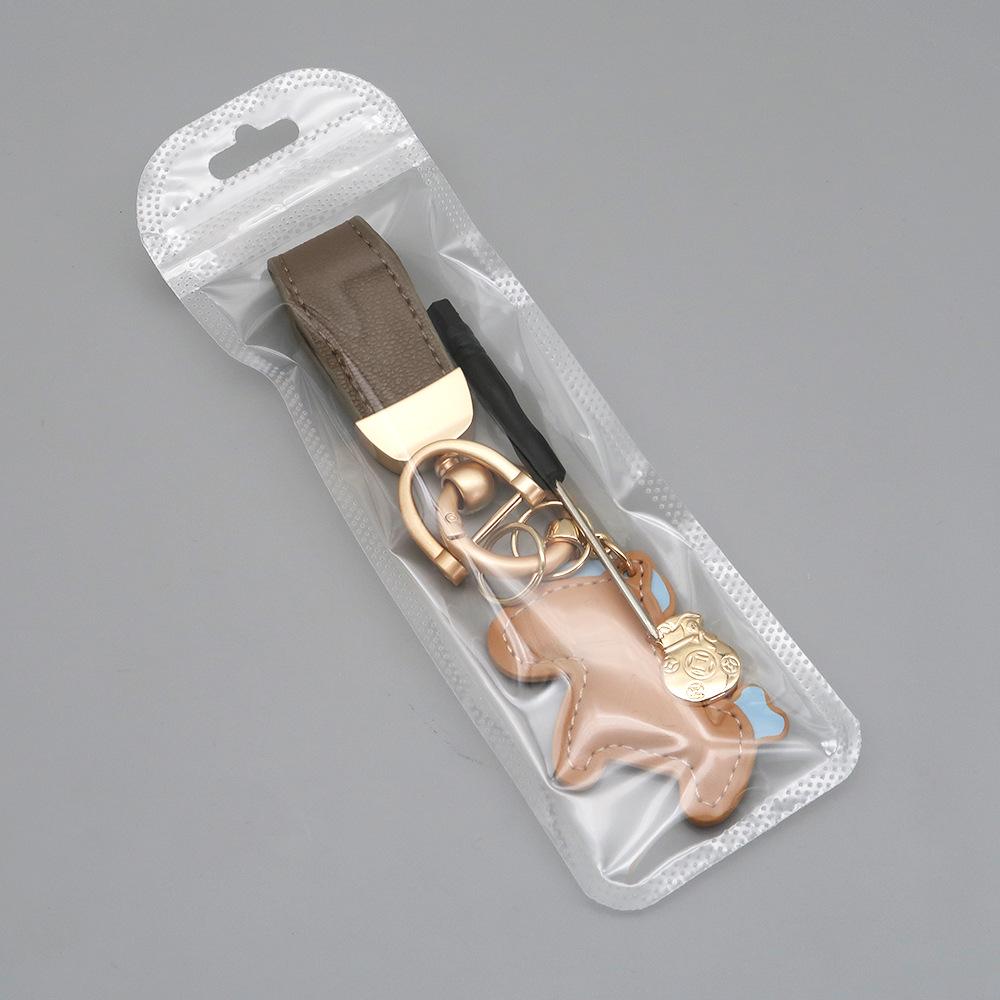 Kleiner Schaf- & Pferdeleder-Schlüsselanhänger mit Perlenanhänger - Gold