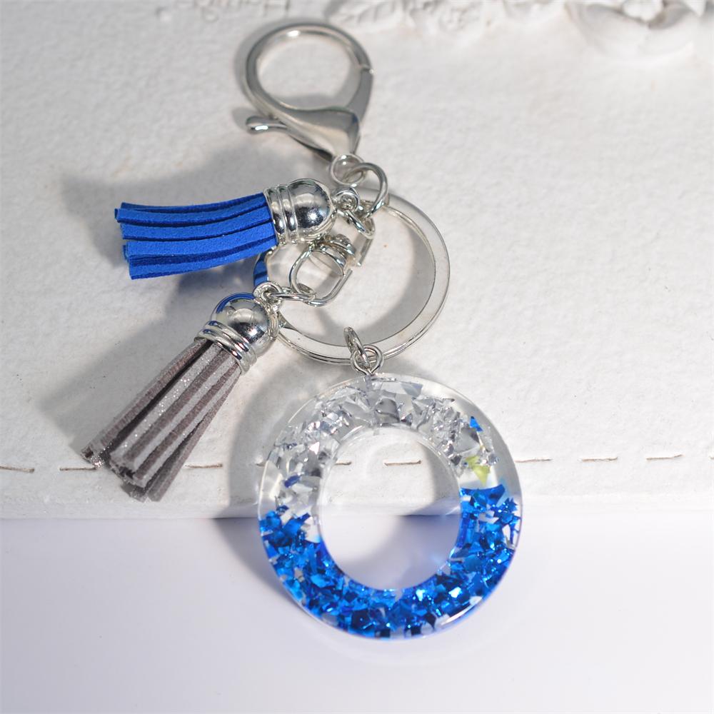 Креативные брелки из смолы с 26 буквами и кисточками — фото 21