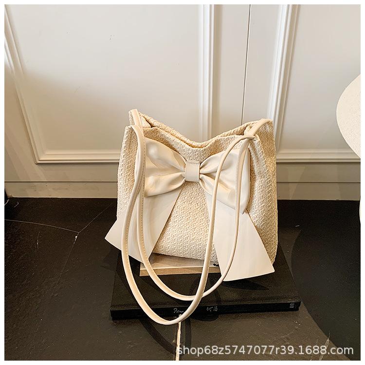 

Western-style bow knitted large bag bag women s 2025 new summer seaside vacation straw bag large-capacity shoulder bag