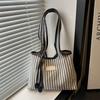 2025 new niche shoulder bag striped simple tote bag simple versatile portable color matching armpit bag