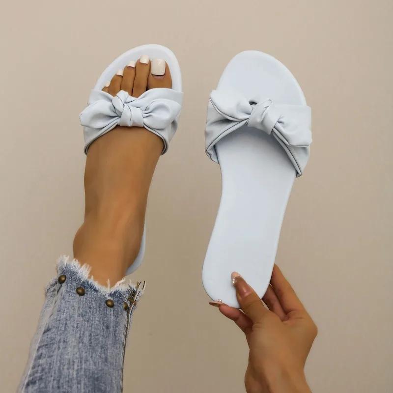 Модне взуття для жінок 2024 Гарячий розпродаж Жіночі шльопанці з відкритим носком Літні з бантом Однотонні Вуличні Повсякденні Пляжні Плоскі Зручні Шльопанці