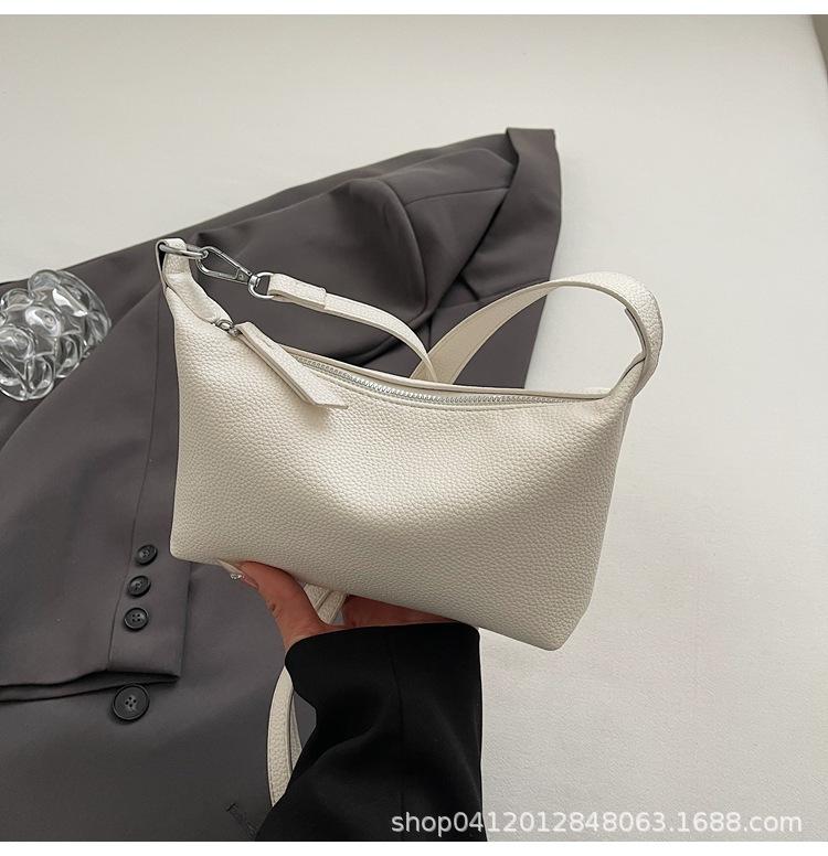 

Оптовая продажа 2025 новая сумка под мышку с узором личи, женская текстурная сумка-багет, для поездок на работу и обратно, сумка-мессенджер, сумка-пельмень