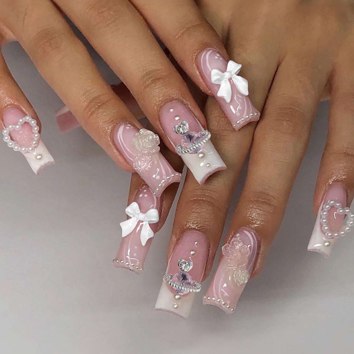 

Handmade Wearable Nails with French Edge, Pearl Rhinestones, and Bow