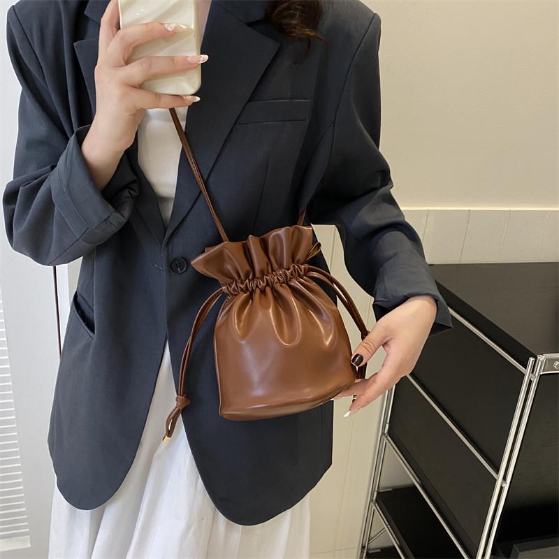 Fashionable Simple Bucket Bag For Women With Soft Structure Available In Black White Brown And Fuchsia