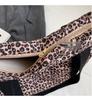 Leopard Print Canvas Tote: Large Capacity Autumn Shoulder Bag for Women, Versatile for College and Commute.