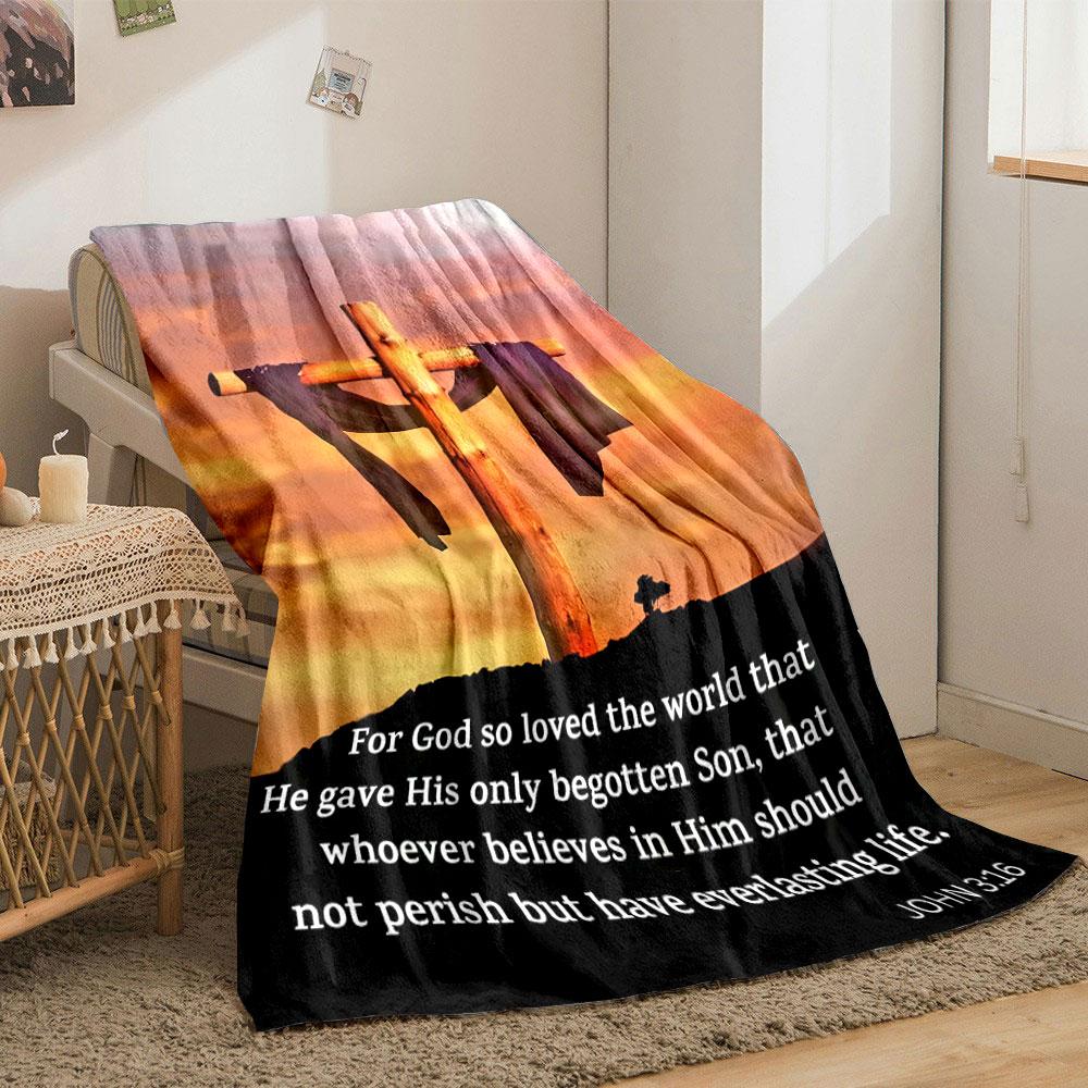 A wooden cross draped in cloth set against a vibrant sunset background. for all seasons blanket lunch break throw gift