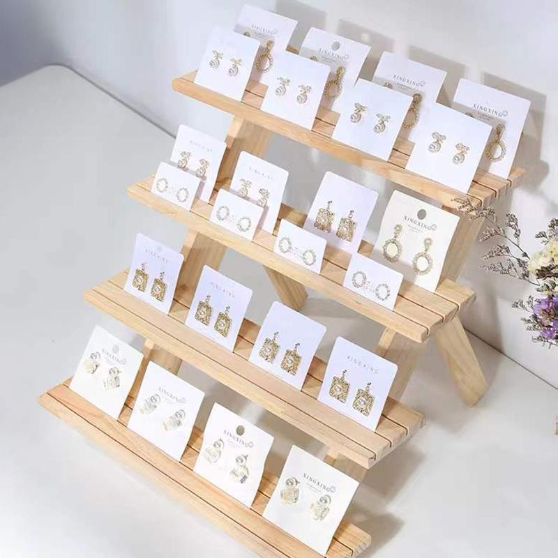 Flerlags utstillingsstativ Loggring Øredobbknapp Utstillingsstativ Avtakbart Øredobbkort Smykkestativ Dukkehånd Visning