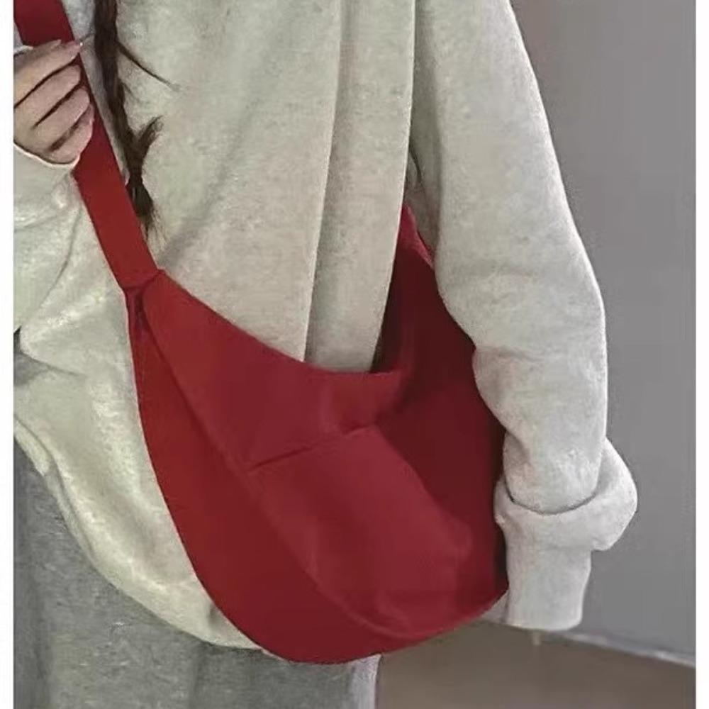 Canvas bag women's large capacity 2025 new casual niche design shoulder messenger bag student commuter dumpling bag