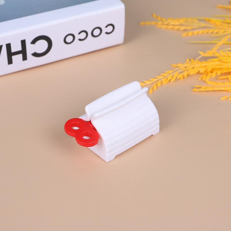 Household Items Multifunction Toothpaste Dispenser Squeezer Toothpaste Clip-on Facial Cleanser Squeezer Bathroom Accessories red
