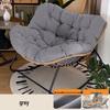 Rattan Rocking Chair: Comfortable Indoor/Outdoor Lounge with a Wrought Iron Frame.