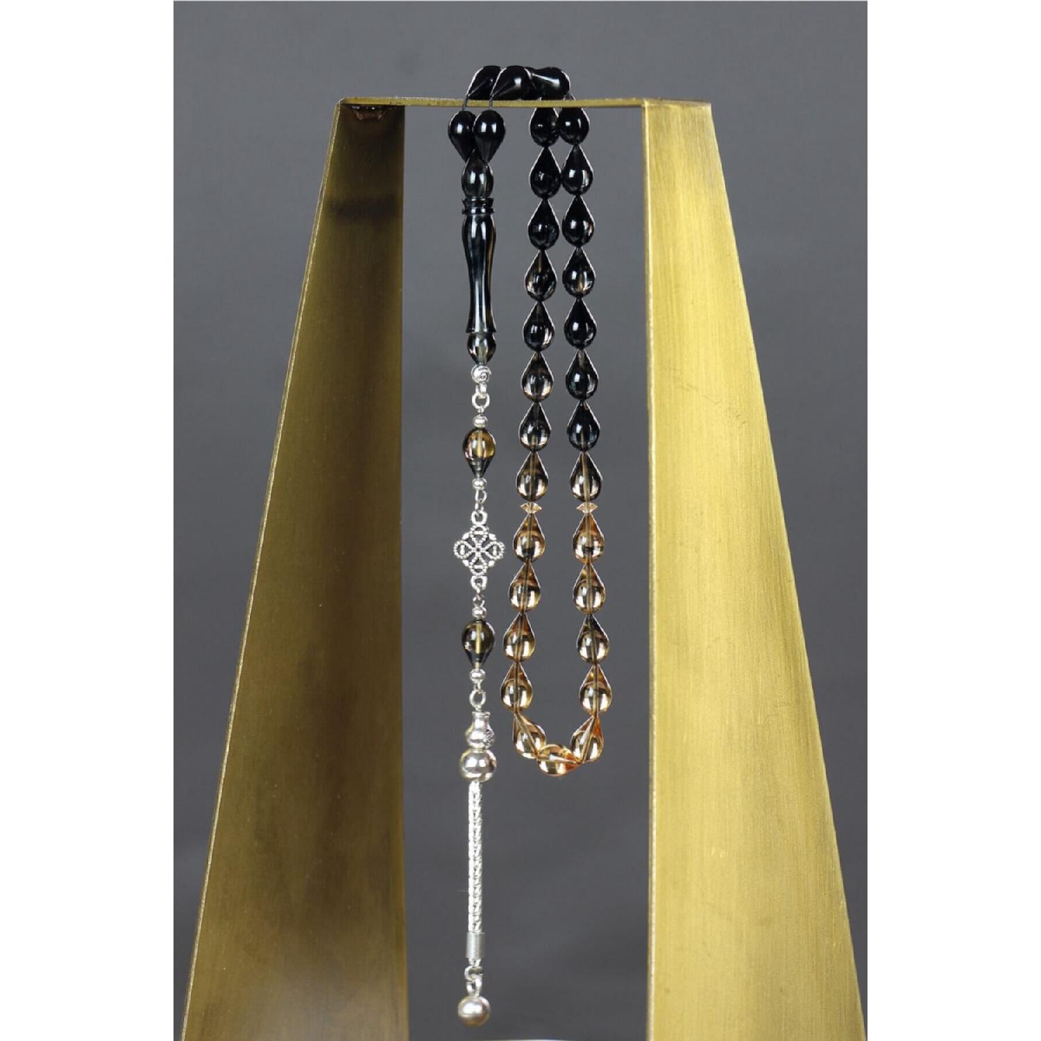 

Чёрно-белые огненно-янтарные четки в огранке Drop Cut