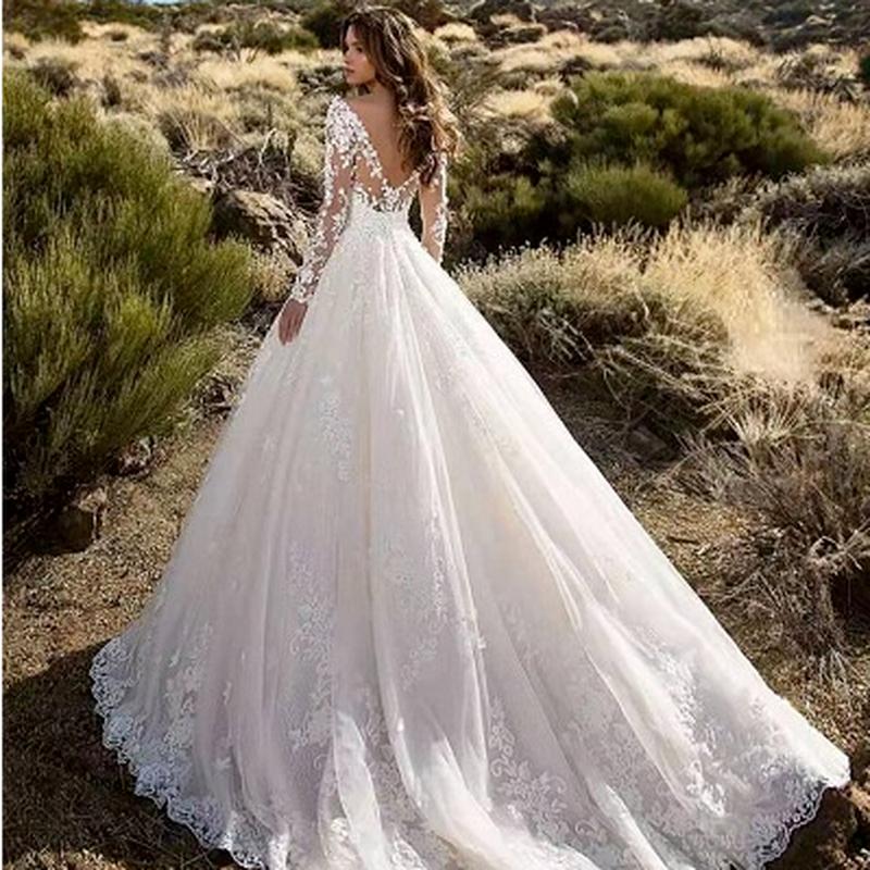 one shoulder long sleeve wedding dress