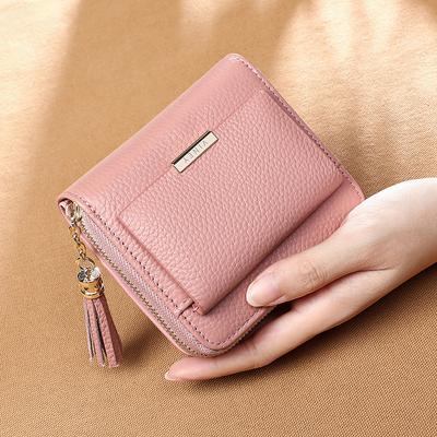 Nouveau portefeuille pour femme, fermeture éclair courte, en cuir véritable, deux volets, couple coréen, pompon, petit porte-monnaie tendance