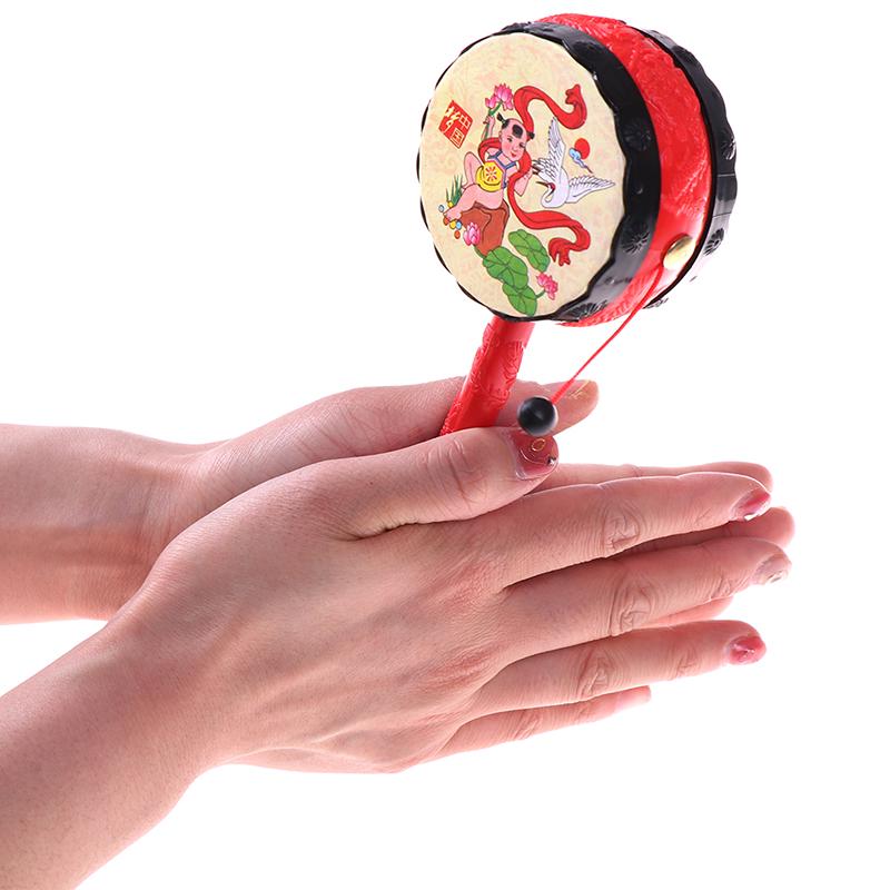 1PCS Baby Kids Cartoon Plastic Chinese Traditional Rattle Drum Spin Fun Toys Hand Bell Music Toys