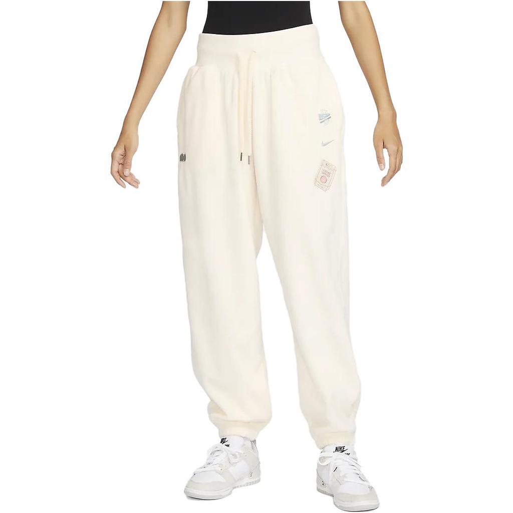 Nike Pantaloni da tuta casual affusolati a maglia a vita alta con coulisse e logo ricamato da donna Avorio chiaro FD5502-110