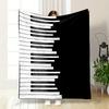 Alternating Black and White Piano Keys Vertically Arranged On a Black Background. for All Seasons Blanket Lunch Break Throw Gift