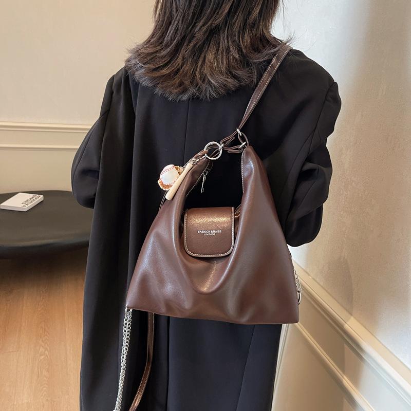 

Autumn and winter new large-capacity tote bag 2025 new fashion single room oblique span backpack student class bag 30*9*31 темно-коричневого кольору