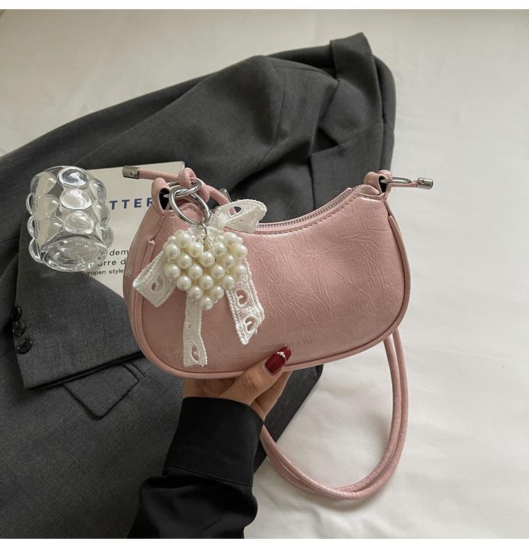 

Korean version of fashion portable solid color cloud bag women s 2025 new foreign style texture messenger versatile women s bag shoulder bag рожевий