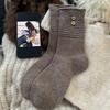 Winter Korean socks women's boneless splicing striped coconut buttons thermal storage heap socks women's socks wool socks