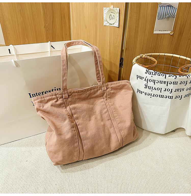 

2025 Korean version of casual shoulder large capacity retro washed canvas bag shopping bag simple and light commuter handbag розовый