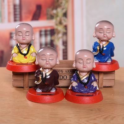Regalo di ornamento per cruscotto interno dell'auto del monaco del fumetto della testa altalena adorabile dell'energia solare