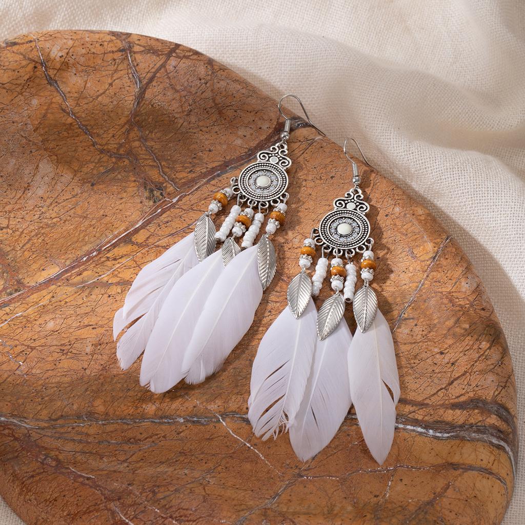 Retro ethnic style woven feathers long fringed earrings, bohemian high-end hollow rice bead earrings