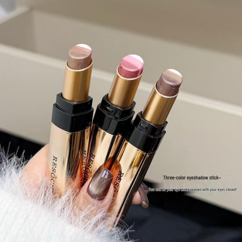 Tri-Color Pearlescent Foil Eyeshadow Stick: No-Fallout, Long-Lasting Glitter Eye Makeup with Easy One-Swipe Application and Gradient Effect.