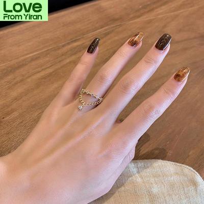 O novo anel de cobre com zircônia brilhante e estrela com borla é adequado para presente de aniversário romântico da moda feminina