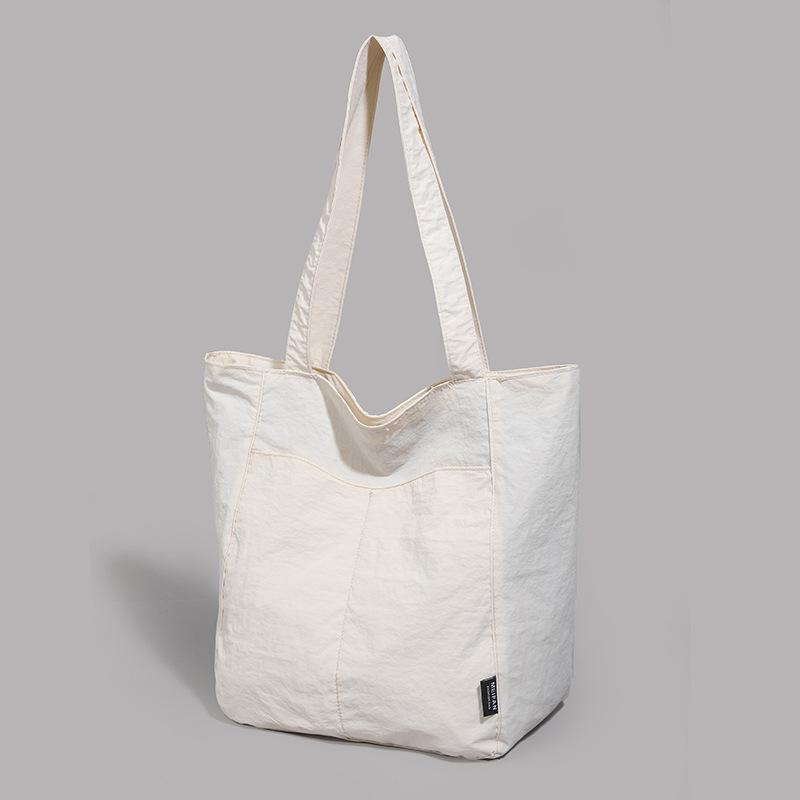 

Casual and simple style tote bag women s new texture versatile student class large-capacity shoulder bag белый
