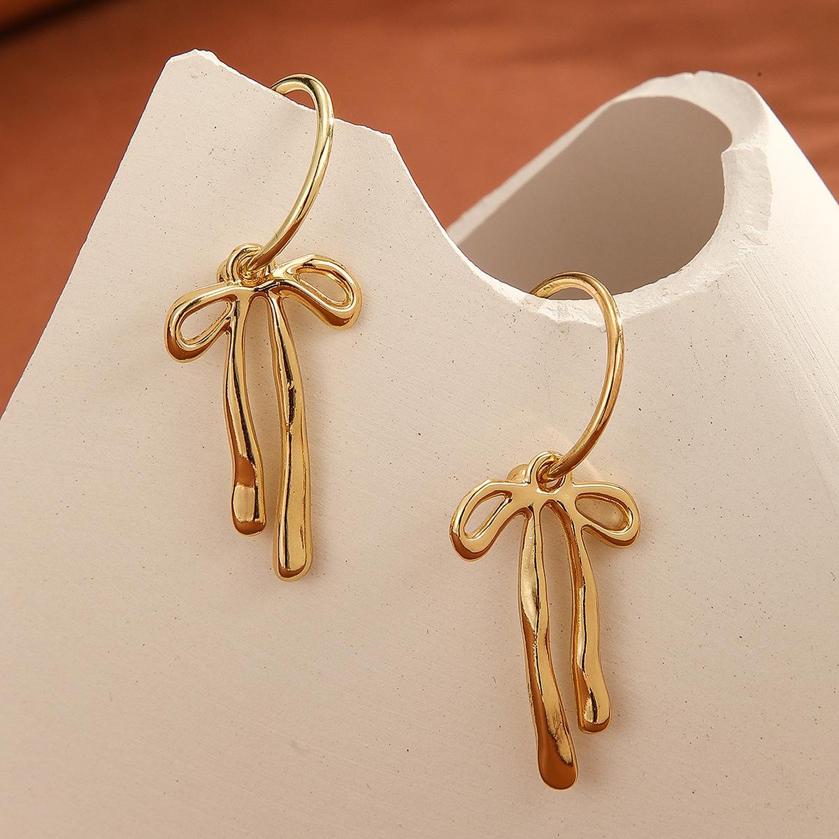 

Bow earrings, European and American fashion temperament earrings, simple niche design, gold high-end earrings