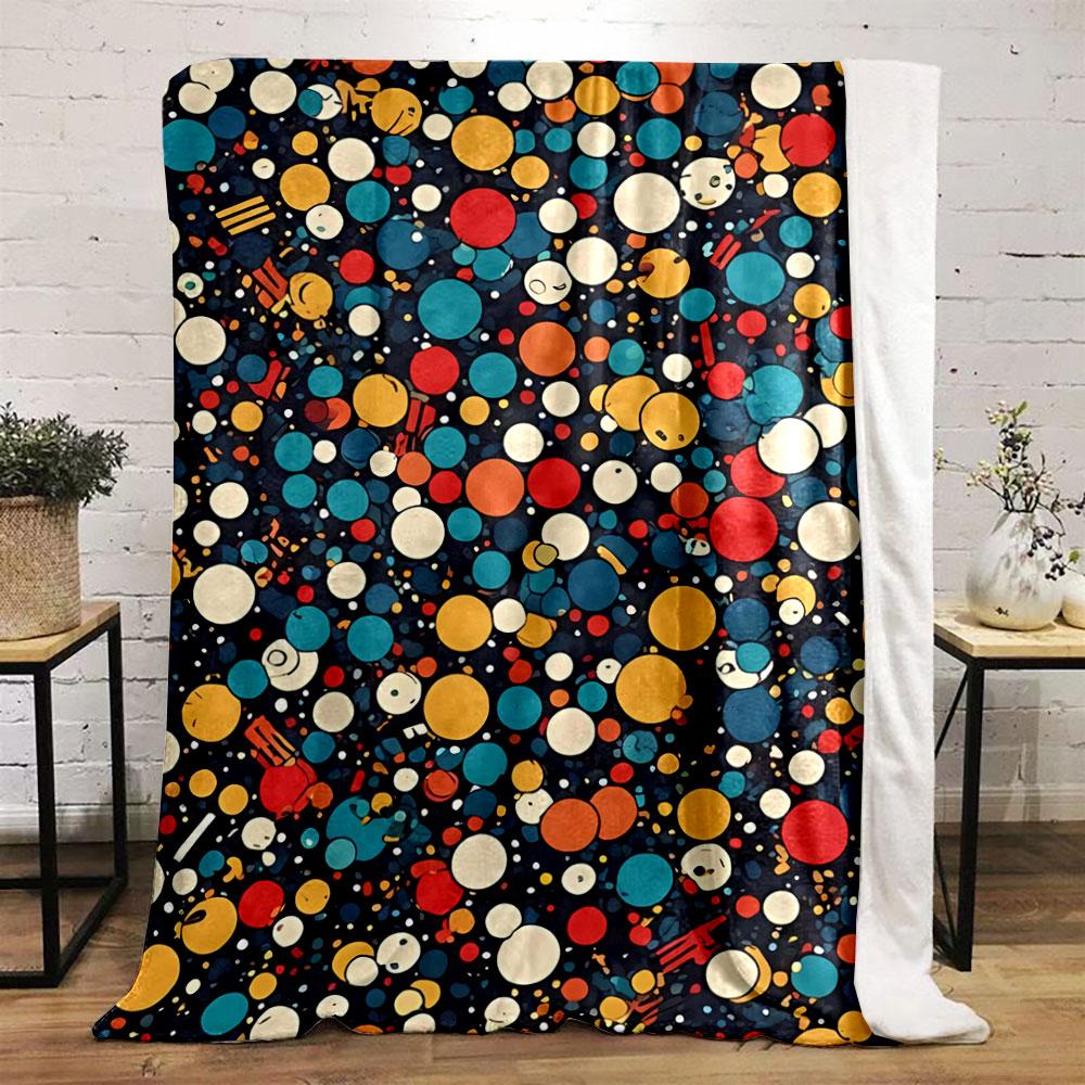 A colorful pattern of varying-sized circles with smiling faces on dark. for all seasons blanket lunch break throw gift