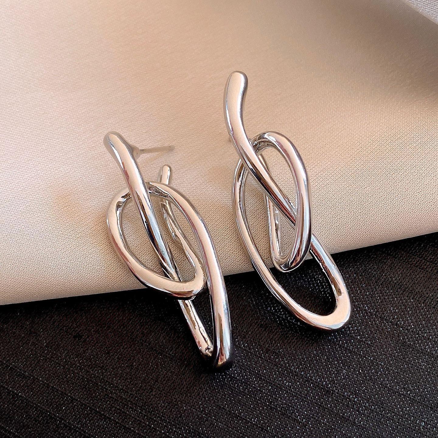 Silver needle European and American cold wind irregular winding earrings earrings simple personalized earrings women
