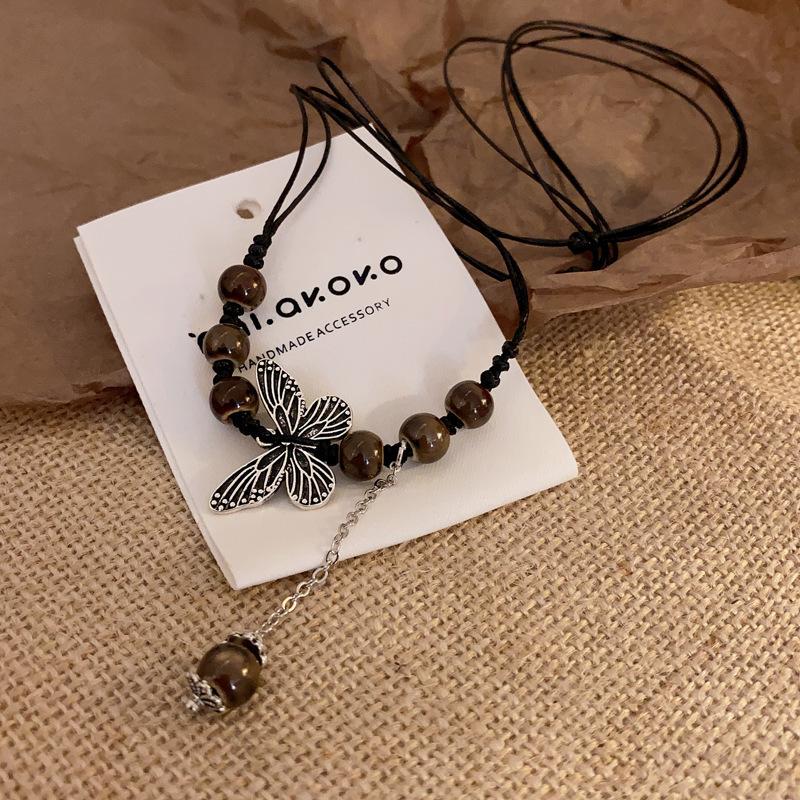 New Chinese leather pendant, fringed necklace, female ethnic style, niche retro sweater chain, fashion and high-end item jewelry.