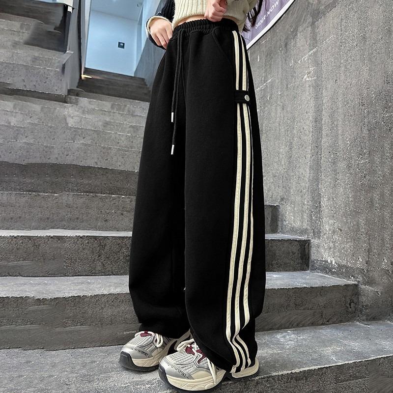 

Дівчачі весняно-осінні 2025 спортивно-кежуал широкі штани з бічною смужкою 160