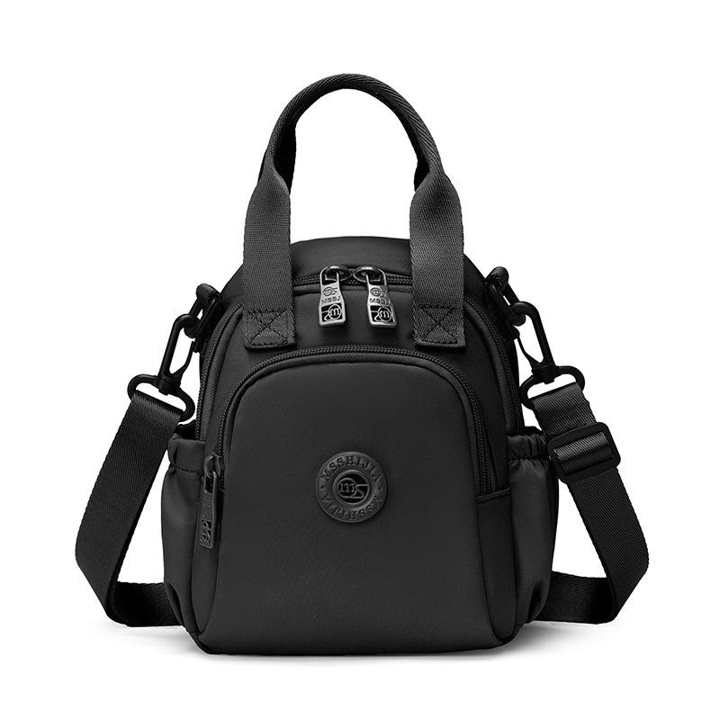 Kompakt Nylon Crossbody Miniryggsäck med Topphandtag Casual Liten Dagryggsäcksväska för Kvinnor Daglig Resa