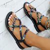 Sandali alla moda da donna bohémien con cinturino intrecciato, motivo floreale, vestibilità elastica, design open-toe, tacco piatto, tomaia e interno in tela, suola in gomma