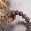 REPTILE BRONZITE BRACELET matt brown bronzite bracelet in 10mm with stainless steel reptile design element