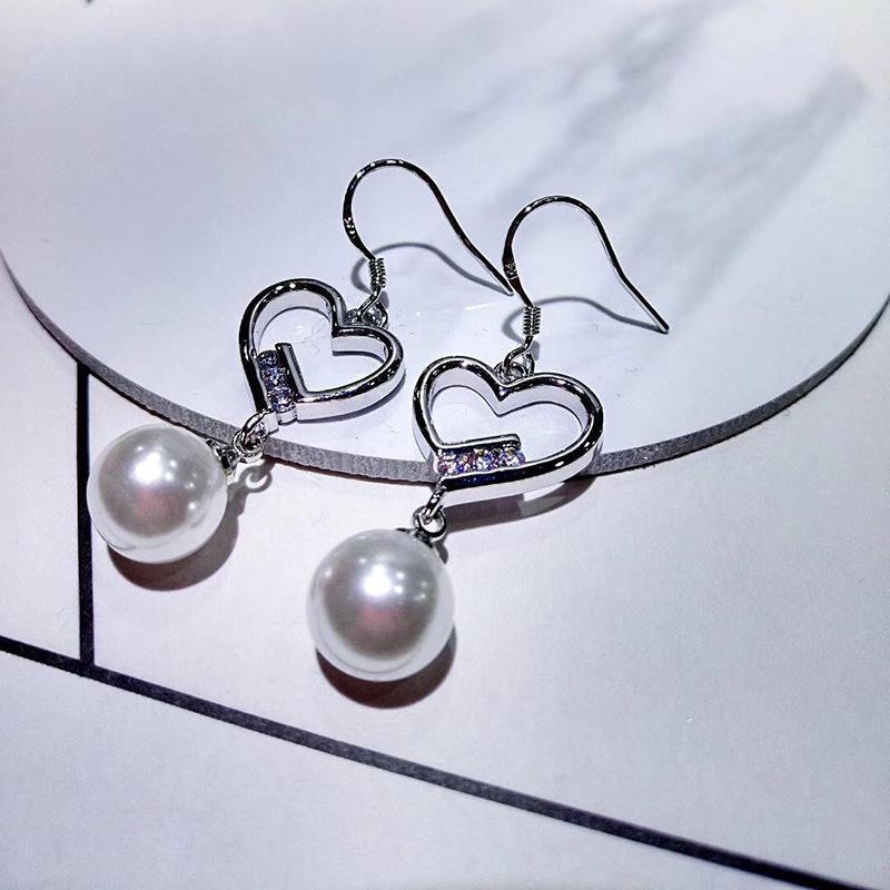 

Серьги Sense Tide Жемчужные серьги Женские Персиковые Сердцевидные Легкая Роскошь Чувство Темперамента Осень и Зима Серьги в форме Сердца Любви Нежные