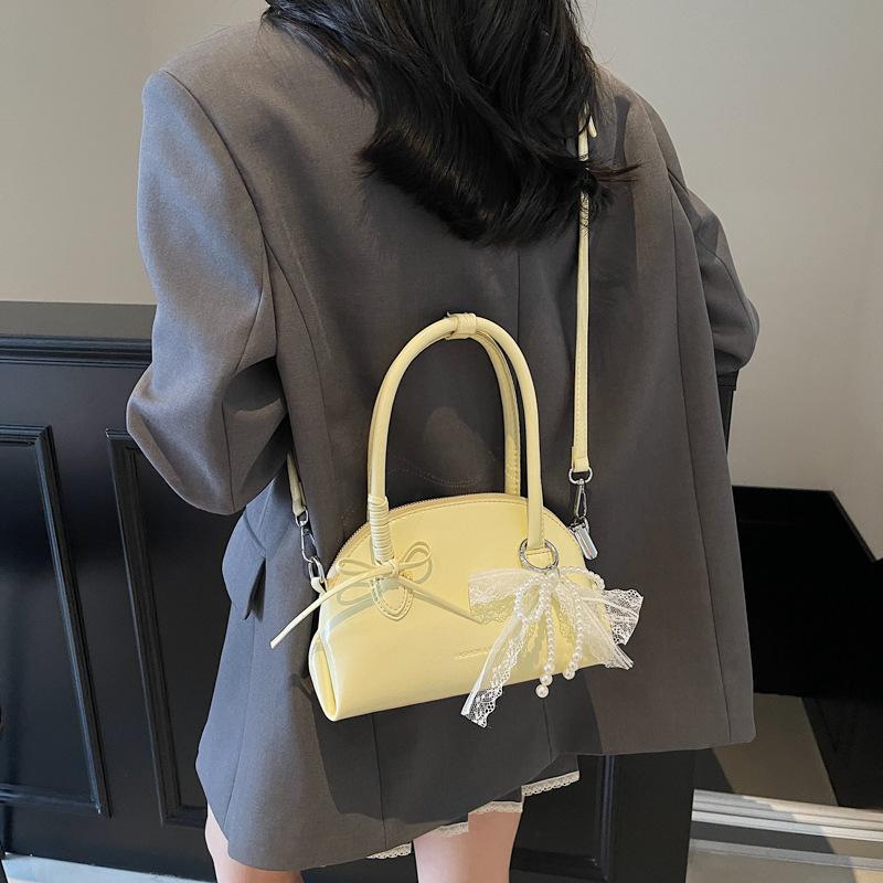 New Sweet Bow Commuter Shell Bag Women's 2025 Korean Version Simple Popular Shoulder Bag Foreign Style Armpit Bag