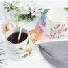 Qianxing Ceramic Plum Blossom Mug with Gold Handle