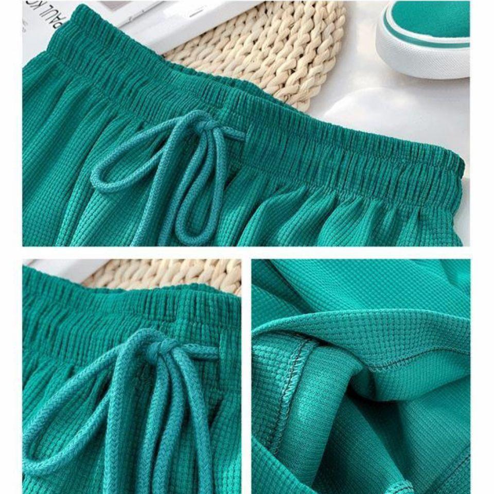 Waflowe elastyczne spodnie z wysokim stanem na co dzień jesienne i zimowe damskie koreański styl luźne drapowane spodnie szerokie nogawki pokaż długość nóg sportowe spodnie do biegania