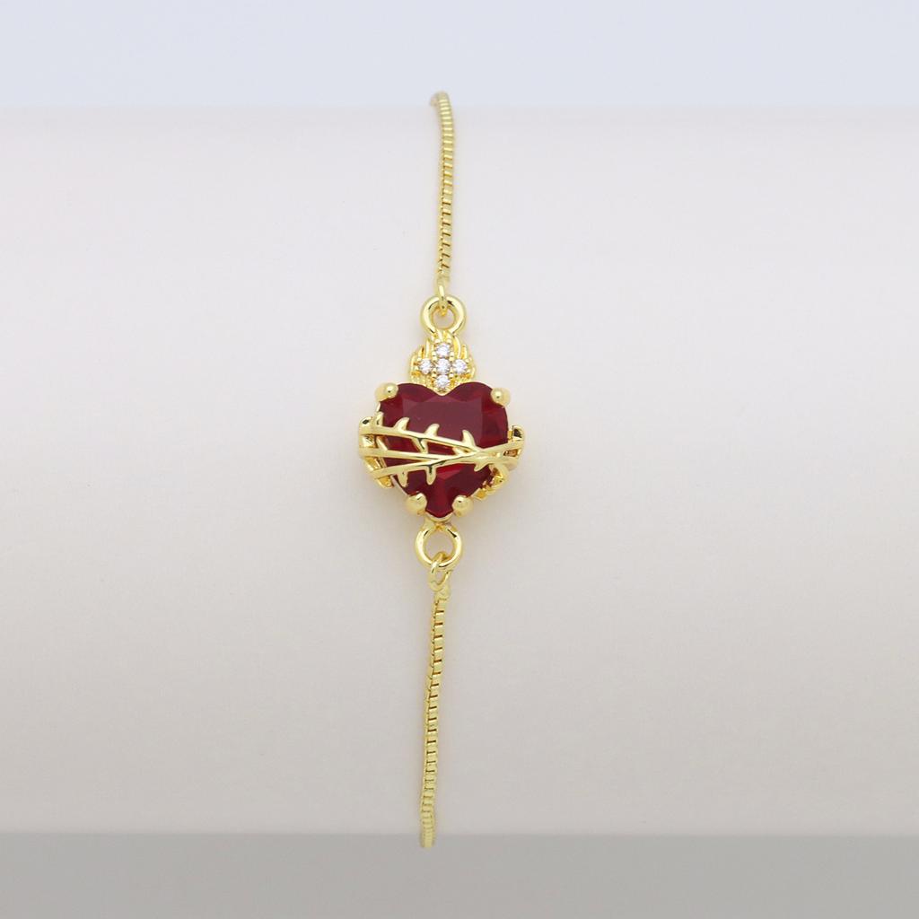 Herzförmige Liebe Kupferplattiertes Farbiges Zirkonium Pfirsichherz, Ein Schwert, das das Herz durchbohrt, kann das Zirkon-Box-Armband ziehen und verstellen.