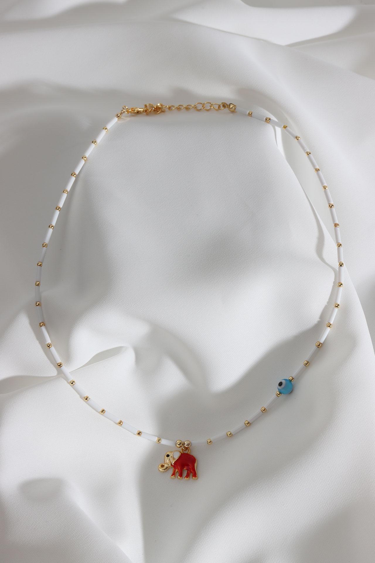

Ожерелье из белых бусин с подвеской в ​​виде слона из красной эмали