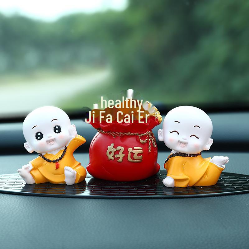 Creative Little Monk Maitreya Buddha Car Ornament: Cute, Shaking Head Resin Doll for Car Interior Decoration and Safety.